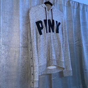 Pink zip up hoodie with snaps on the side